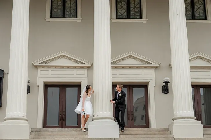bride and groom outside of city hall