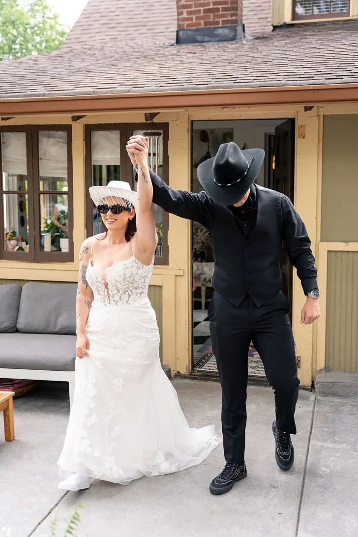 bride and groom holding hands and walking down the aisle