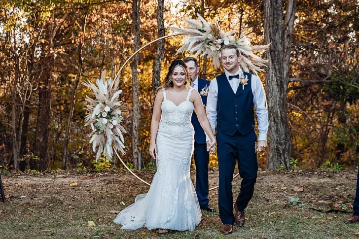 bride and groom holding hands after wedding ceremony
