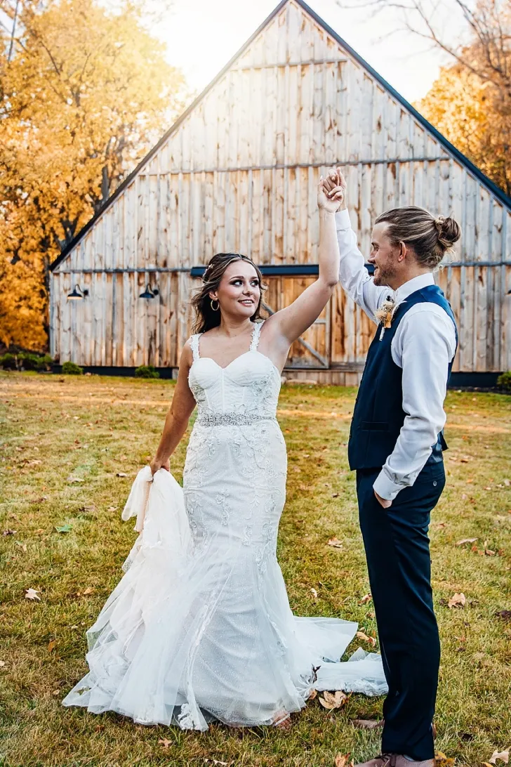 bride and groom dancing outside of wedding venue